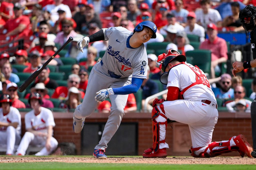 Jun 8, 2025; St. Louis, Missouri, USA; Los Angeles Dodgers designated hitter Shohei Ohtani (17) reacts after he was hit by a pitch by St. Louis Cardinals relief pitcher Matt Svanson (not pictured) during the eighth inning at Busch Stadium. Mandatory Credit: Jeff Curry-Imagn Images