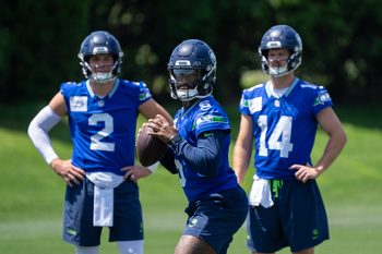 Jun 11, 2025; Renton, WA, USA; Seattle Seahawks quarterback Jalen Milroe (6) looks to pass as quarterback Drew Lock (2) and quarterback Sam Darnold (14) during mini-camp at Virginia Mason Athletic Center. Mandatory Credit: Stephen Brashear-Imagn Images