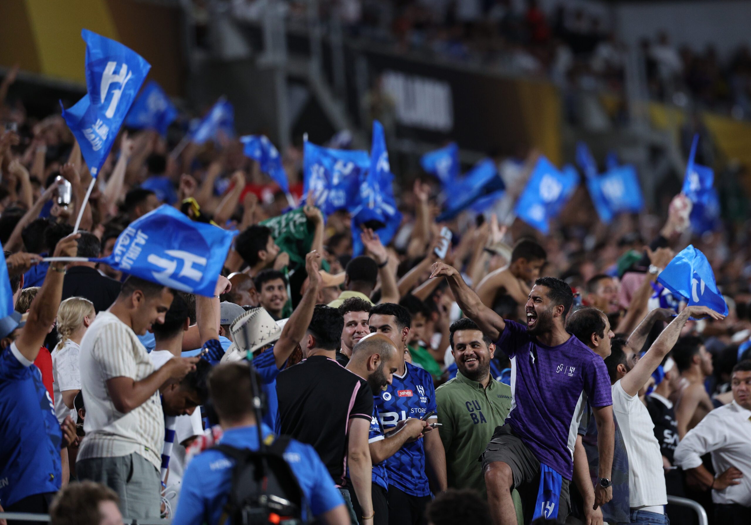 Jun 30, 2025; Orlando, Florida, USA; Al Hilal FC fans react in extra time against Manchester City during a round of 16 match of the 2025 FIFA Club World Cup at Camping World Stadium. Mandatory Credit: Nathan Ray Seebeck-Imagn Images