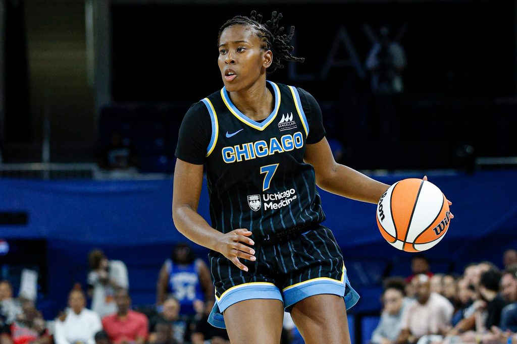 Jul 12, 2025; Chicago, Illinois, USA; Chicago Sky guard Ariel Atkins (7) brings the ball up court against the Minnesota Lynx during the second half of a WNBA game at Wintrust Arena. Mandatory Credit: Kamil Krzaczynski-Imagn Images