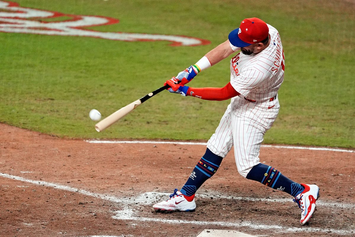 Jul 15, 2025; Cumberland, Georgia, USA; National League designated hitter Kyle Schwarber (12) of the Philadelphia Phillies hits a home run in the swing off of after the 2025 MLB All Star Game ended in a tie at Truist Park. Mandatory Credit: Dale Zanine-Imagn Images