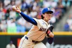 Jul 20, 2025; Seattle, Washington, USA; Seattle Mariners starting pitcher Bryan Woo (22) throws against the Houston Astros during the second inning at T-Mobile Park. Mandatory Credit: Joe Nicholson-Imagn Images