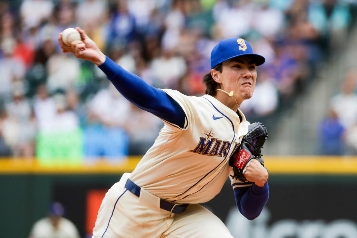Jul 20, 2025; Seattle, Washington, USA; Seattle Mariners starting pitcher Bryan Woo (22) throws against the Houston Astros during the second inning at T-Mobile Park. Mandatory Credit: Joe Nicholson-Imagn Images