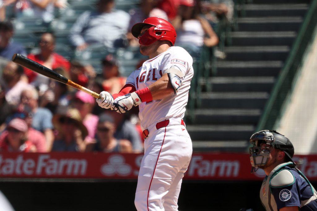 Jul 27, 2025; Anaheim, California, USA; Los Angeles Angels designated hitter Mike Trout (27) hits a two-run home run for his 1,000th career RBI during the fifth inning against the Seattle Mariners at Angel Stadium. Mandatory Credit: Kiyoshi Mio-Imagn Images