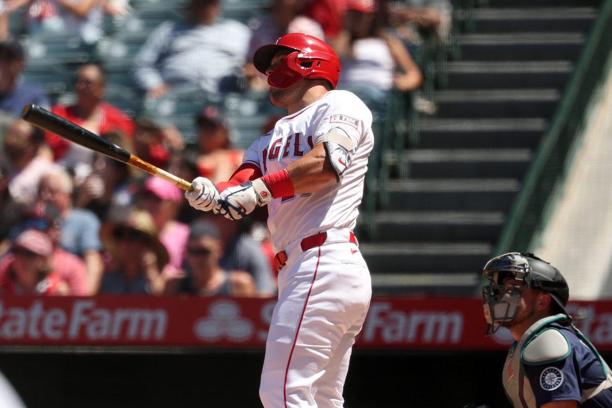 Jul 27, 2025; Anaheim, California, USA; Los Angeles Angels designated hitter Mike Trout (27) hits a two-run home run for his 1,000th career RBI during the fifth inning against the Seattle Mariners at Angel Stadium. Mandatory Credit: Kiyoshi Mio-Imagn Images