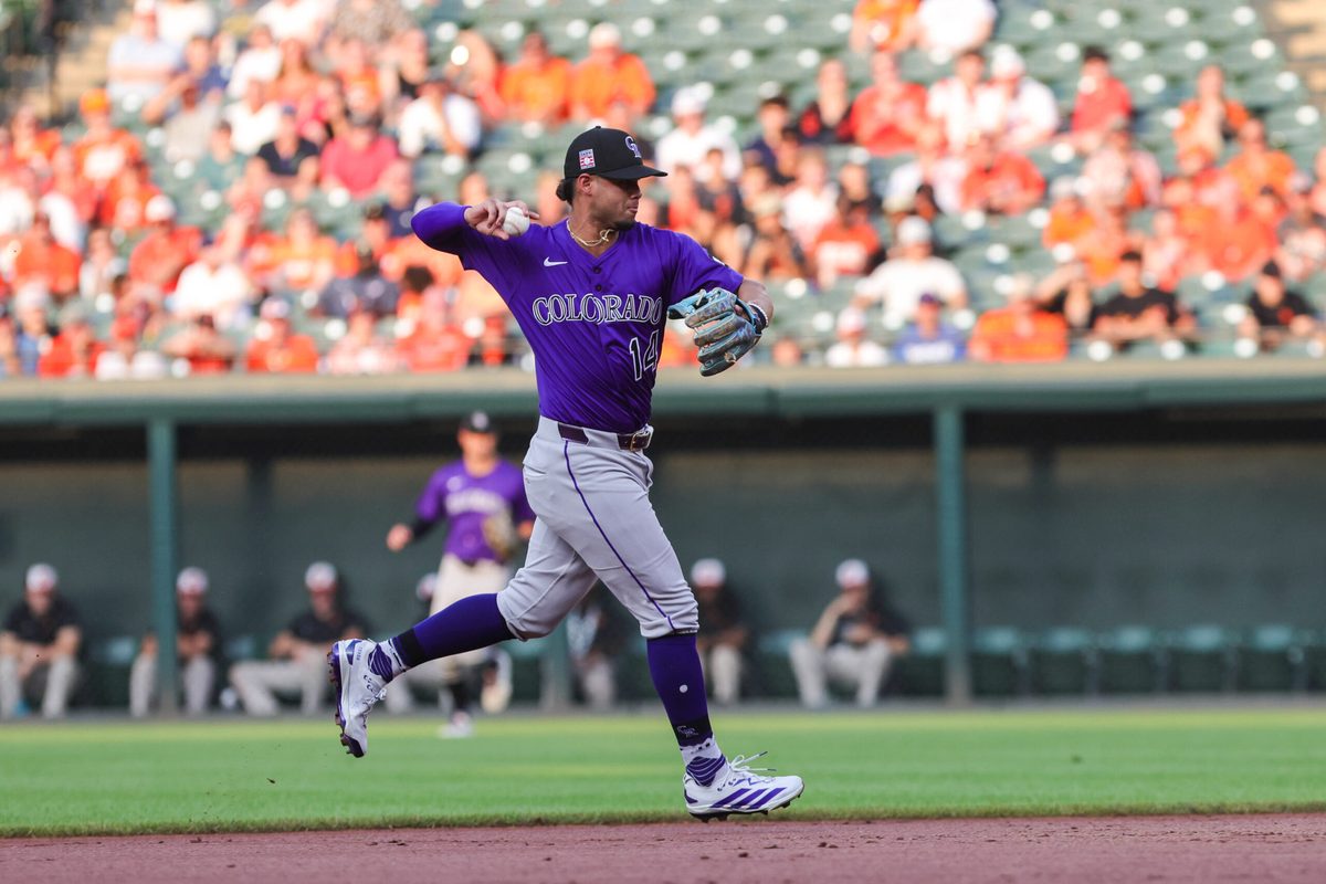 Jul 26, 2025; Baltimore, Maryland, USA; Colorado Rockies shortstop Ezequiel Tovar (14) making a play at first for the out against the Baltimore Orioles at Oriole Park at Camden Yards. Mandatory Credit: Lexi Thompson-Imagn Images