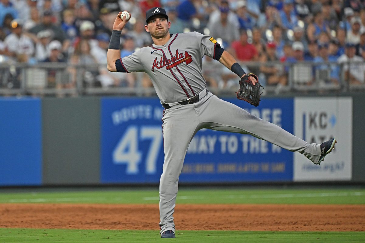 Jul 28, 2025; Kansas City, Missouri, USA;  Atlanta Braves third baseman Austin Riley (27) throws the ball to first base in the sixth inning against the Kansas City Royals at Kauffman Stadium. Mandatory Credit: Peter Aiken-Imagn Images