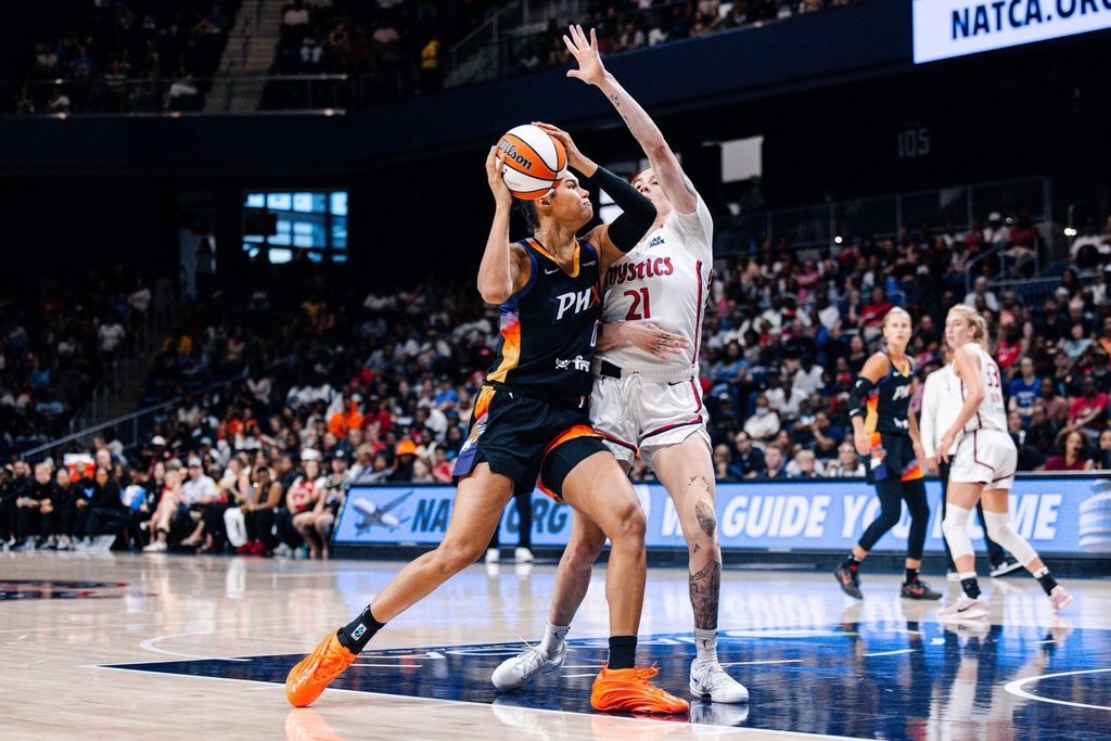 Jul 27, 2025; Washington, District of Columbia, USA; Phoenix Mercury forward Satou Sabally (0) prepares to shoot the ball while Washington Mystics forward Emily Engstler (21) defends in the second half at CareFirst Arena. Mandatory Credit: Emily Faith Morgan-Imagn Images