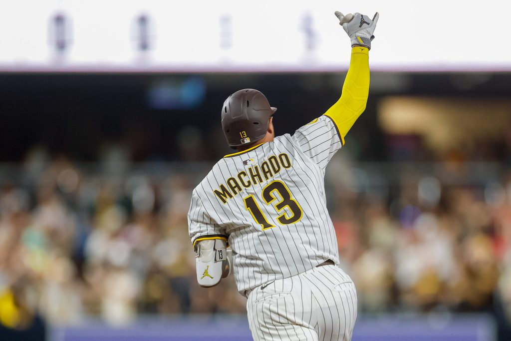 Jul 29, 2025; San Diego, California, USA; San Diego Padres designated hitter Manny Machado (13) celebrates after hitting a three-run home run during the seventh inning against the New York Mets at Petco Park. Mandatory Credit: David Frerker-Imagn Images