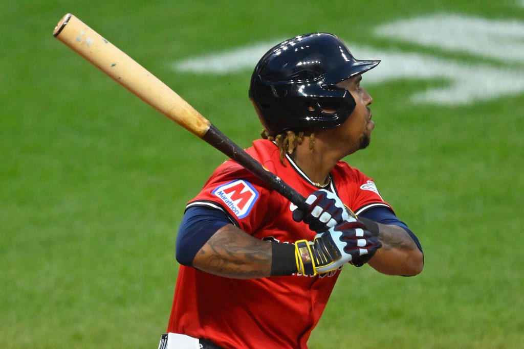 Jul 30, 2025; Cleveland, Ohio, USA; Cleveland Guardians third baseman Jose Ramirez (11) singles in the eighth inning against the Colorado Rockies at Progressive Field. Mandatory Credit: David Richard-Imagn Images