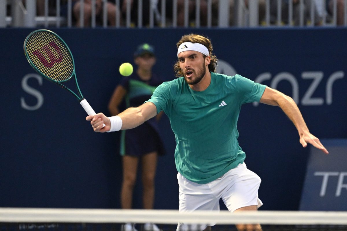 Jul 30, 2025; Toronto, ON, Canada; Stefanos Tsitsipas (GRE) plays a shot against Christopher O'Connell (AUS) during second round play at Sobeys Stadium. Mandatory Credit: Dan Hamilton-Imagn Images