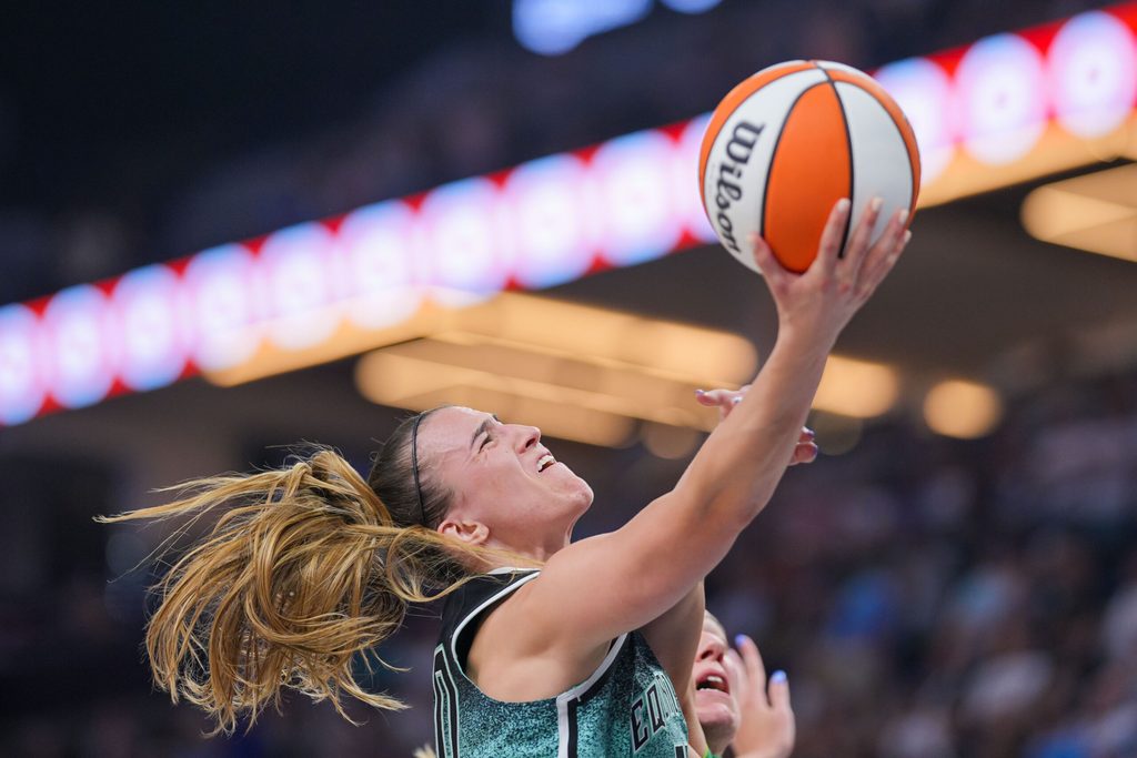 Jul 30, 2025; Minneapolis, Minnesota, USA; New York Liberty guard Sabrina Ionescu (20) shoots against the Minnesota Lynx in the fourth quarter at Target Center. Mandatory Credit: Brad Rempel-Imagn Images