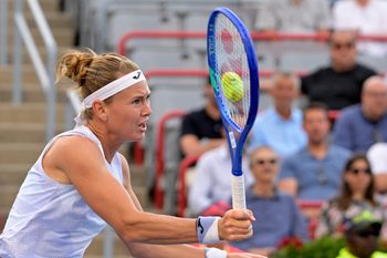 Jul 31, 2025; Montreal, QC, Canada; Marie Bouzkova (CZE) volleys against Victoria Mboko (CAN) in third round play at IGA Stadium. Mandatory Credit: Eric Bolte-Imagn Images