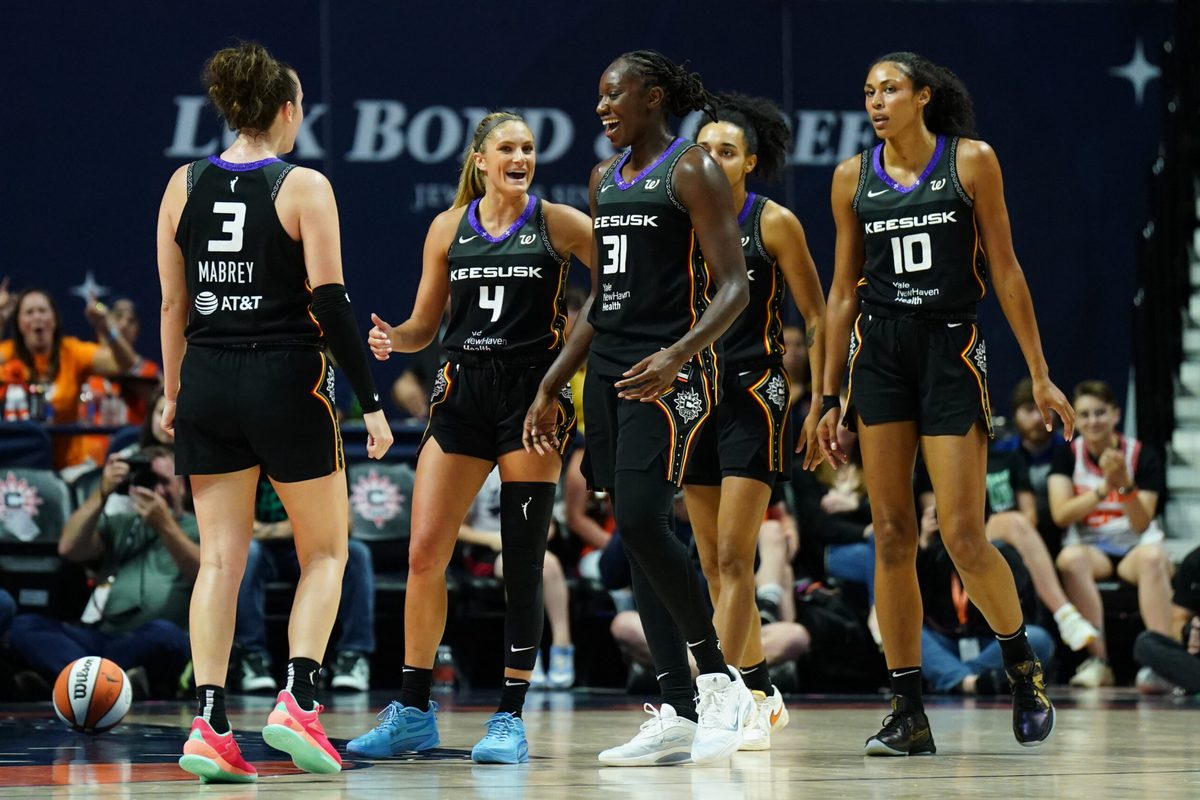 Aug 1, 2025; Uncasville, Connecticut, USA; Connecticut Sun center Tina Charles (31) and teammates react after a play against the New York Liberty in the second half at Mohegan Sun Arena. Mandatory Credit: David Butler II-Imagn Images