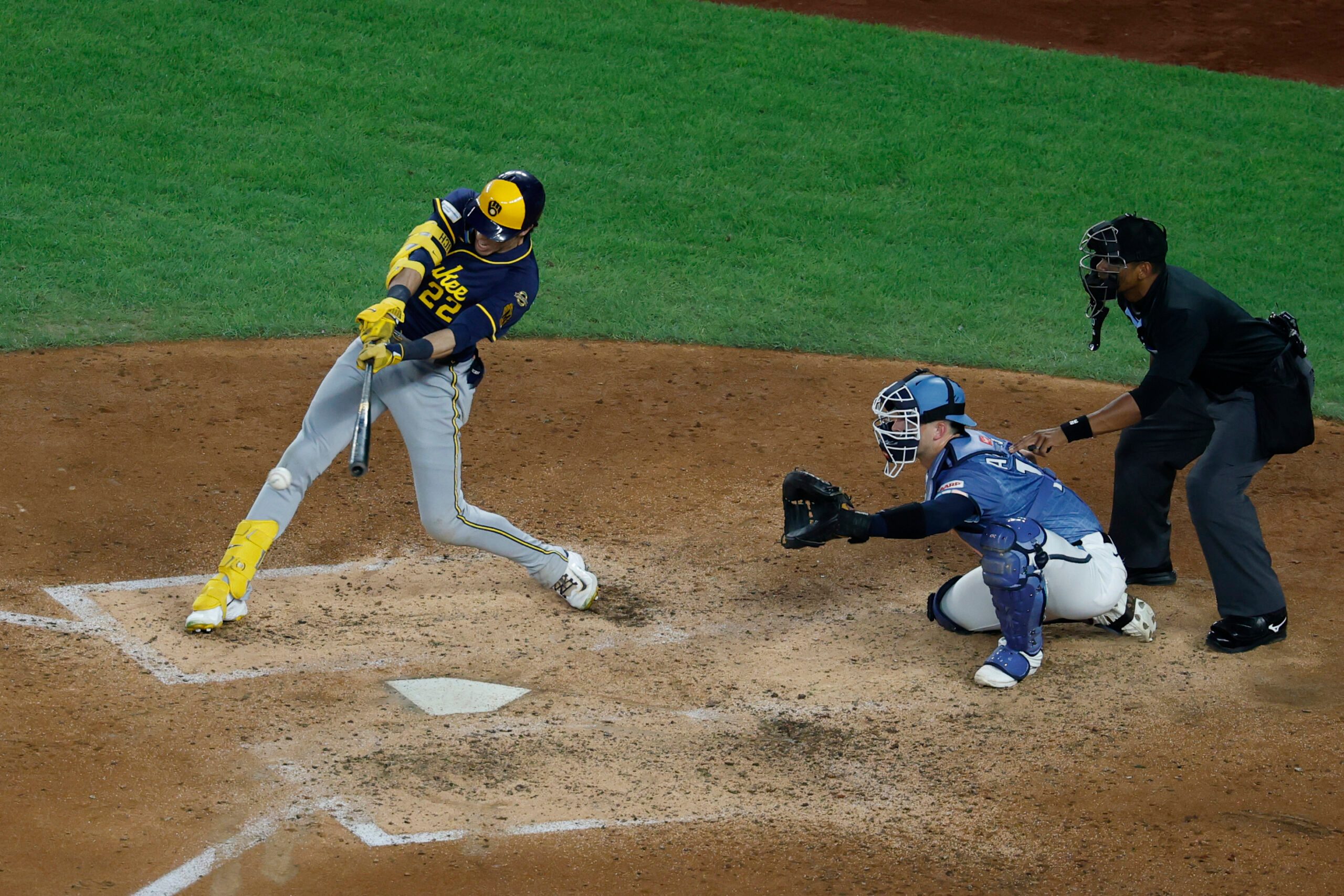 Aug 1, 2025; Washington, District of Columbia, USA; Milwaukee Brewers outfielder Christian Yelich (22) hits an RBI single against the Washington Nationals during the fifth inning at Nationals Park. Mandatory Credit: Geoff Burke-Imagn Images