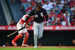 Aug 1, 2025; Anaheim, California, USA; Chicago White Sox center fielder Luis Robert Jr. (88) hits a sacrifice RBI against the Los Angeles Angels during the fourth inning at Angel Stadium. Mandatory Credit: Gary A. Vasquez-Imagn Images