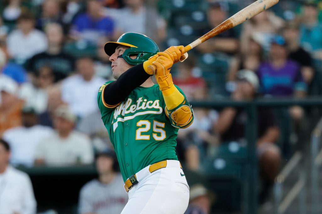 Aug 1, 2025; West Sacramento, California, USA; Athletics designated hitter Brent Rooker (25) hits an RBI sac fly during the first inning against the Arizona Diamondbacks at Sutter Health Park. Mandatory Credit: Sergio Estrada-Imagn Images