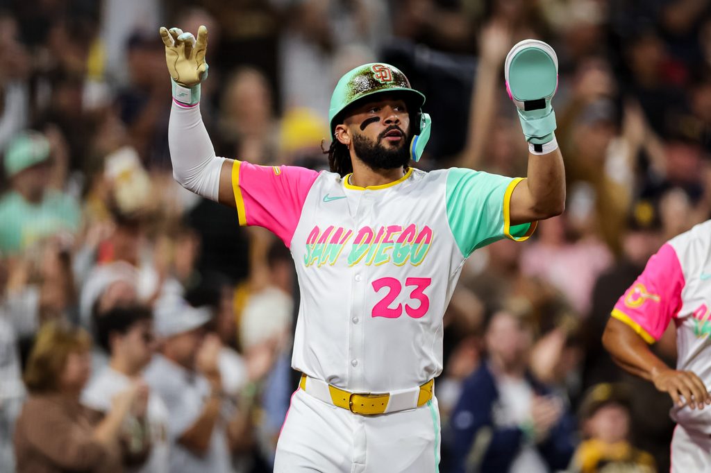 Aug 1, 2025; San Diego, California, USA; San Diego Padres right fielder Fernando Tatis Jr. (23) scores on a two-RBI single from center fielder Jackson Merrill (3) during the fifth inning against the St. Louis Cardinals at Petco Park. Mandatory Credit: Chadd Cady-Imagn Images