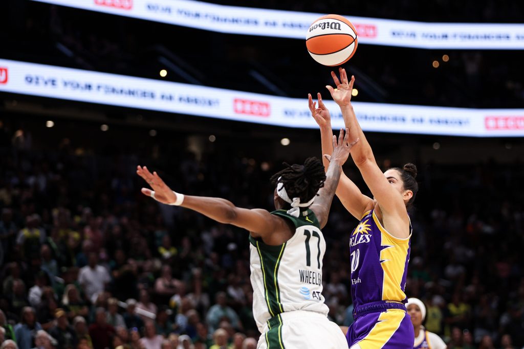 Aug 1, 2025; Seattle, Washington, USA; Los Angeles Sparks guard Kelsey Plum (10) shoots over Seattle Storm guard Erica Wheeler (17) during overtime at Climate Pledge Arena. Mandatory Credit: Kevin Ng-Imagn Images