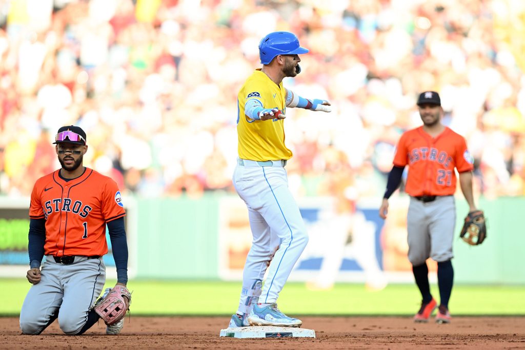 Aug 2, 2025; Boston, Massachusetts, USA; Boston Red Sox shortstop Trevor Story (10) hits a RBI double against the Houston Astros during the seventh inning at Fenway Park. Mandatory Credit: Brian Fluharty-Imagn Images