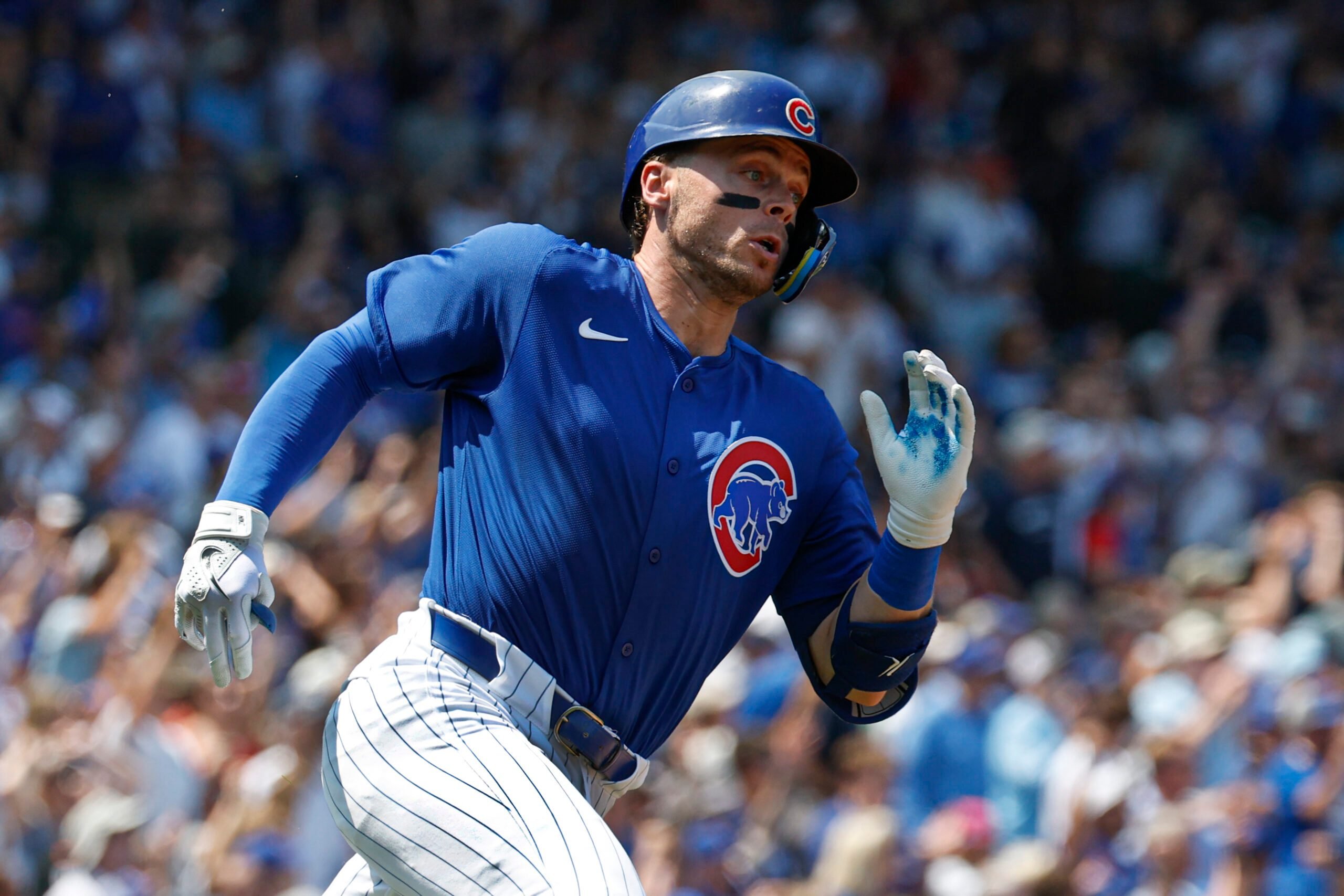 Aug 2, 2025; Chicago, Illinois, USA; Chicago Cubs shortstop Nico Hoerner  wearing number 23 in honor the late Hall of Fame second baseman Ryne Sandberg runs after hitting an RBI-ground rule double against the Baltimore Orioles during the second inning at Wrigley Field. Mandatory Credit: Kamil Krzaczynski-Imagn Images