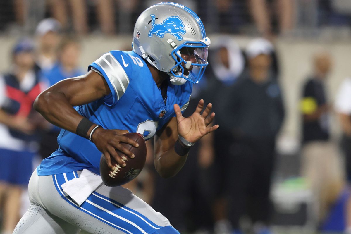 Jul 31, 2025; Canton, Ohio, USA; Detroit Lions quarterback Hendon Hooker (2) scrambles with the ball against the Los Angeles Chargers during the second half at Tom Benson Hall of Fame Stadium. Mandatory Credit: Charles LeClaire-Imagn Images