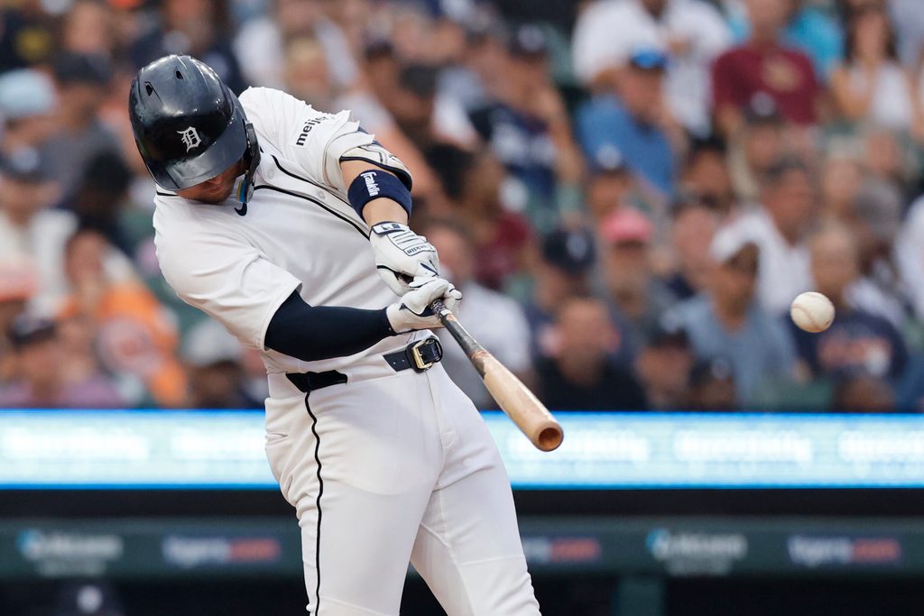 Aug 4, 2025; Detroit, Michigan, USA; Detroit Tigers first baseman Spencer Torkelson (20) hits a single in the sixth inning against the Minnesota Twins at Comerica Park. Mandatory Credit: Rick Osentoski-Imagn Images