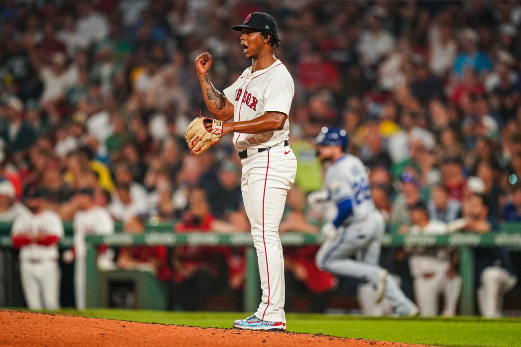 Aug 4, 2025; Boston, Massachusetts, USA; Boston Red Sox pitcher Brayan Bello (66) reacts after a line drive out by Kansas City Royals outfielder Kyle Isbel (28) to end the side in the fourth inning at Fenway Park. Mandatory Credit: David Butler II-Imagn Images