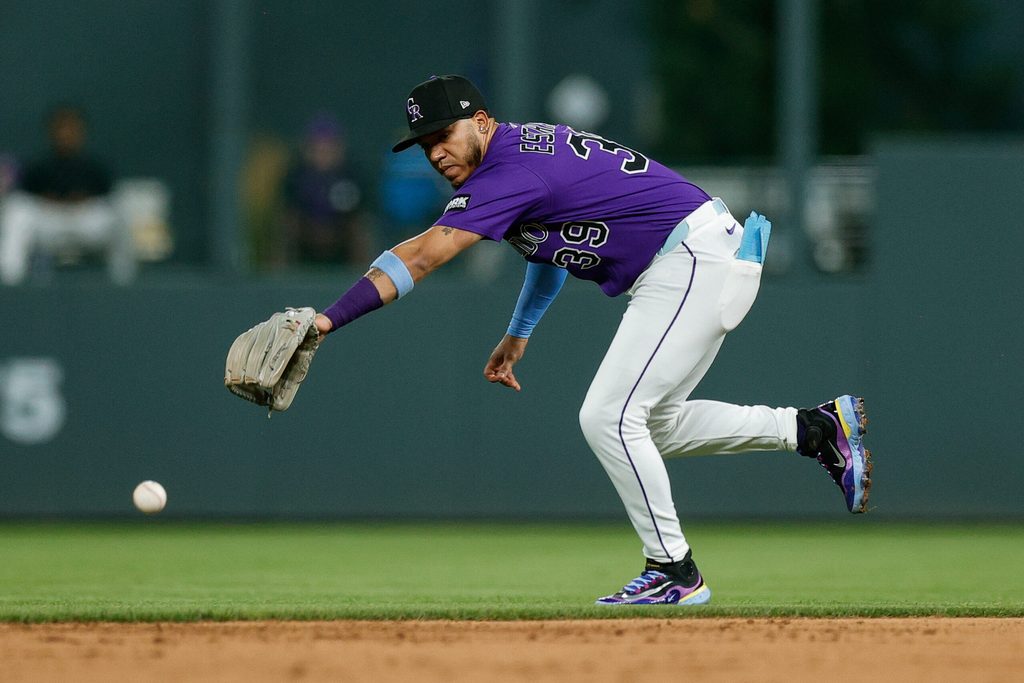 Aug 4, 2025; Denver, Colorado, USA; Colorado Rockies second baseman Thairo Estrada (39) is unable to field the ball in the ninth inning against the Toronto Blue Jays at Coors Field. Mandatory Credit: Isaiah J. Downing-Imagn Images