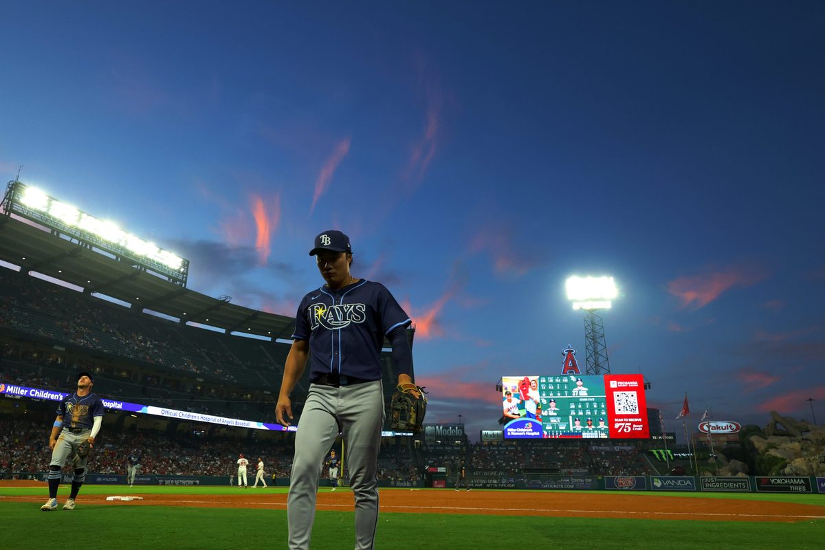 Aug 4, 2025; Anaheim, California, USA; Tampa Bay Rays second baseman Ha-Seong Kim (7) walks back to the dugout between the fourth inning against the Los Angeles Angels at Angel Stadium. Mandatory Credit: Kiyoshi Mio-Imagn Images