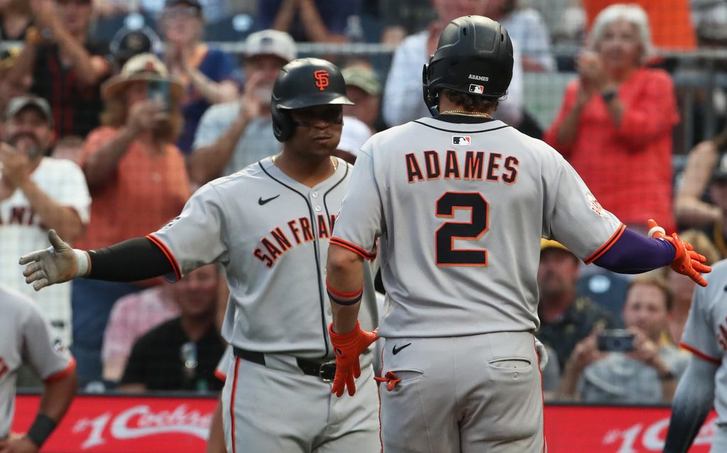 Aug 5, 2025; Pittsburgh, Pennsylvania, USA; San Francisco Giants designated hitter Rafael Devers (left) greets shortstop Willy Adames (2) crossing home plate on on a two run home run against the Pittsburgh Pirates during the fifth inning at PNC Park. Mandatory Credit: Charles LeClaire-Imagn Images