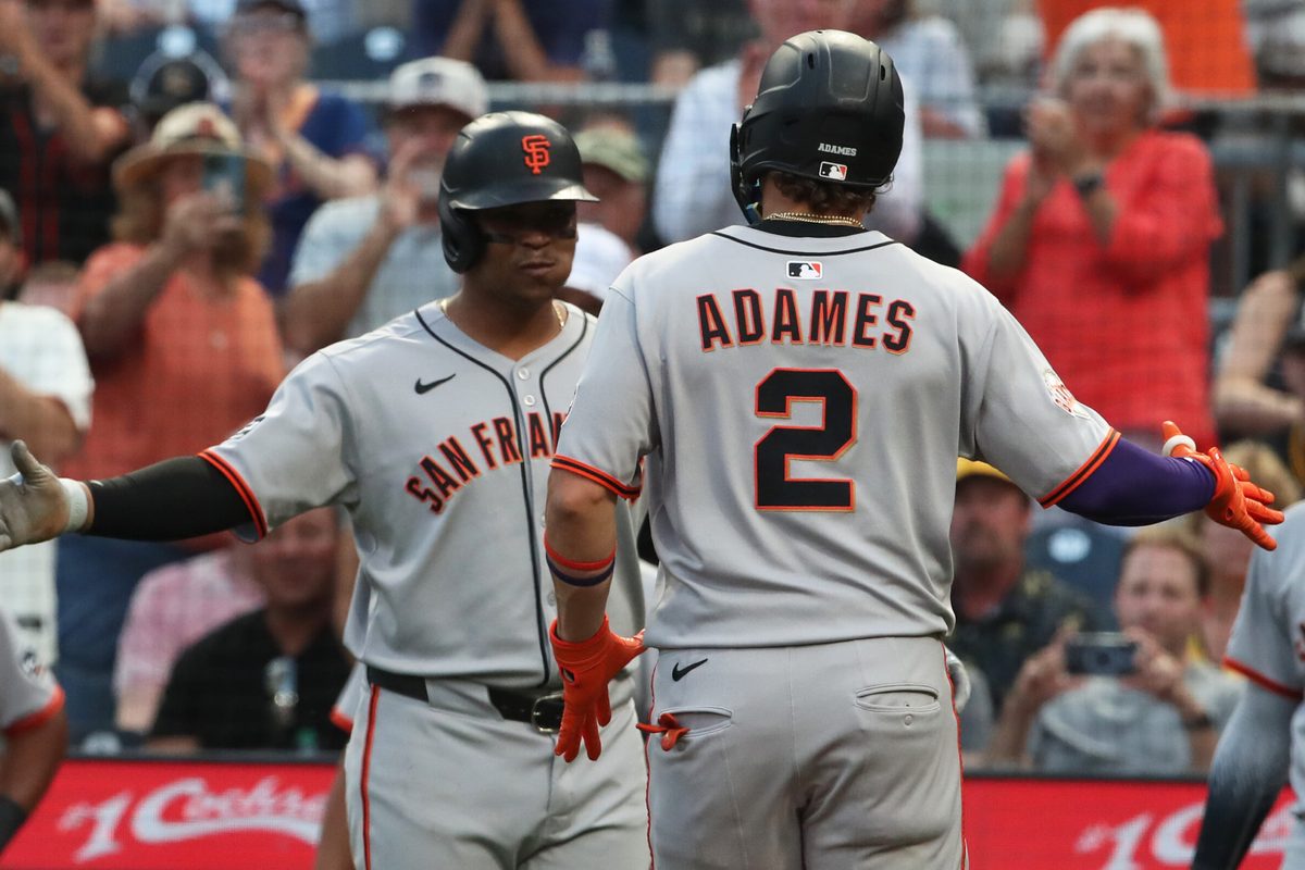 Aug 5, 2025; Pittsburgh, Pennsylvania, USA; San Francisco Giants designated hitter Rafael Devers (left) greets shortstop Willy Adames (2) crossing home plate on on a two run home run against the Pittsburgh Pirates during the fifth inning at PNC Park. Mandatory Credit: Charles LeClaire-Imagn Images