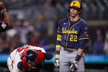 Aug 5, 2025; Atlanta, Georgia, USA; Milwaukee Brewers left fielder Christian Yelich (22) reacts after being tagged out by Atlanta Braves catcher Sean Murphy (12) in the ninth inning at Truist Park. Mandatory Credit: Brett Davis-Imagn Images