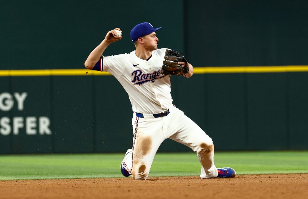 Aug 5, 2025; Arlington, Texas, USA; Texas Rangers shortstop Corey Seager (5) makes a diving stop to start a double play during the ninth inning against the New York Yankees at Globe Life Field. Mandatory Credit: Kevin Jairaj-Imagn Images