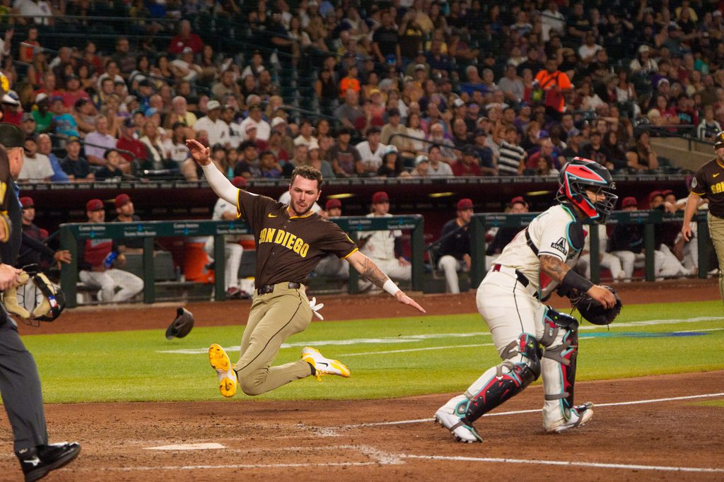 Aug 5, 2025; Phoenix, Arizona, USA; San Diego Padres outfielder Jackson Merrill (3) scores a run in the seventh inning against the Arizona Diamondbacks at Chase Field. Mandatory Credit: Allan Henry-Imagn Images