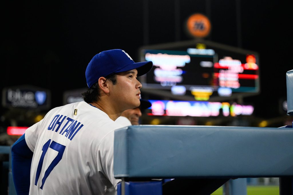 Aug 5, 2025; Los Angeles, California, USA; Los Angeles Dodgers designated hitter Shohei Ohtani (17) looks on from the dugout during the ninth inning against the St. Louis Cardinals at Dodger Stadium. Mandatory Credit: William Liang-Imagn Images