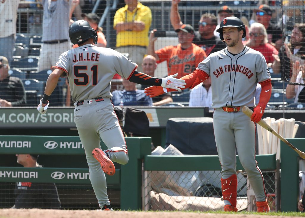 Aug 6, 2025; Pittsburgh, Pennsylvania, USA; San Francisco Giants catcher Patrick Bailey (right) greets center fielder Jung Hoo Lee (51) crossing home plate to score the game winning run against the Pittsburgh Pirates during the ninth inning at PNC Park. Mandatory Credit: Charles LeClaire-Imagn Images