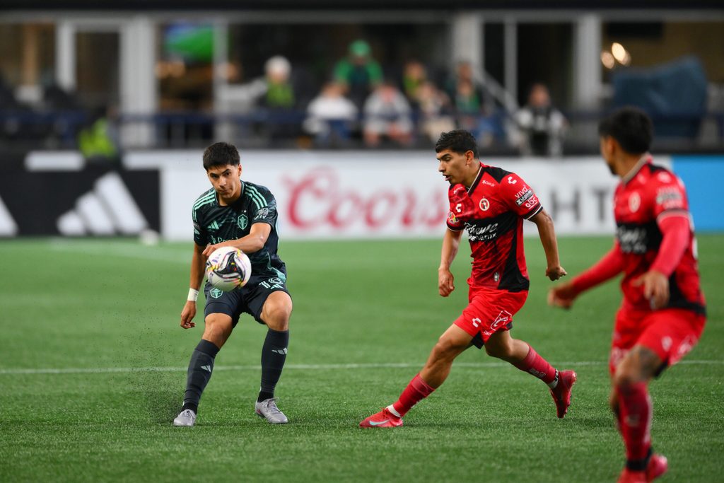 Aug 6, 2025; Seattle, WA, USA; Seattle Sounders FC midfielder Obed Vargas (18) passes the ball against Tijuana during the second half at Lumen Field. Mandatory Credit: Steven Bisig-Imagn Images