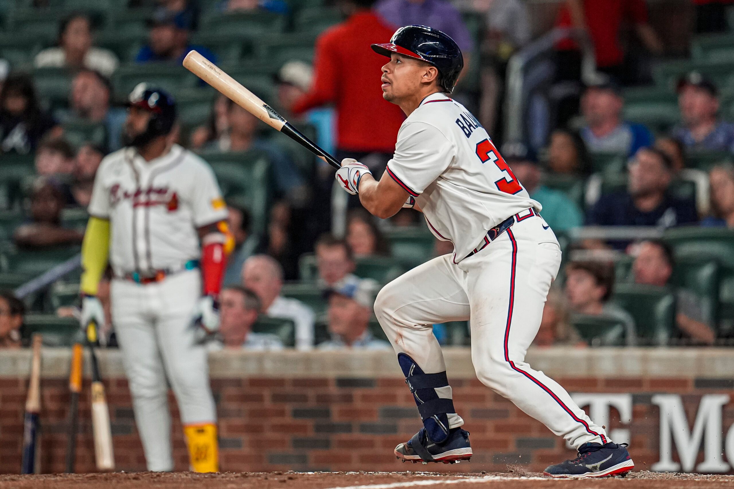 Aug 7, 2025; Cumberland, Georgia, USA; Atlanta Braves catcher Drake Baldwin (30) hits a three run home run against the Miami Marlins during the eighth inning at Truist Park. Mandatory Credit: Dale Zanine-Imagn Images