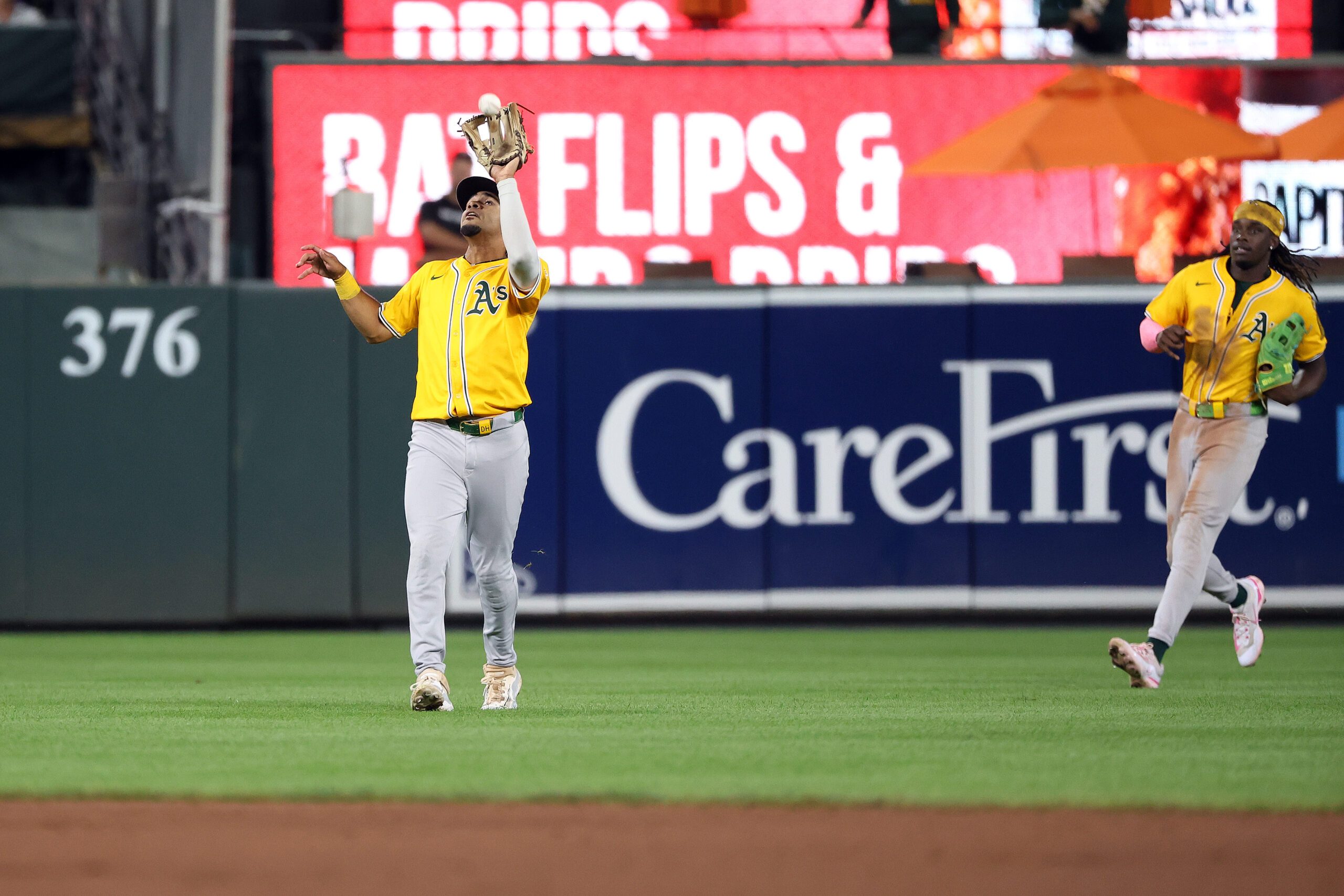 Aug 8, 2025; Baltimore, Maryland, USA; Oakland Athletics third baseman Darell Hernaiz (2) makes a catch for an out during the eighth inning against the Oakland Athletics at Oriole Park at Camden Yards. Mandatory Credit: Daniel Kucin Jr.-Imagn Images