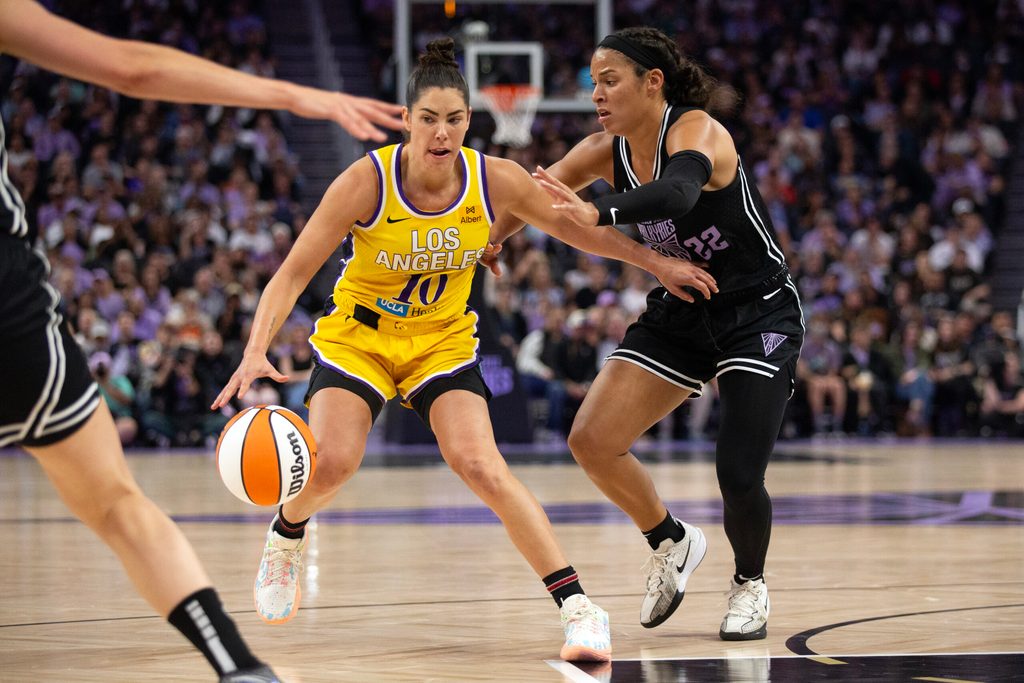 Aug 9, 2025; San Francisco, California, USA; Los Angeles Sparks guard Kelsey Plum (10) dribbles around Golden State Valkyries guard Veronica Burton (22) during the fourth quarter at Chase Center. Mandatory Credit: D. Ross Cameron-Imagn Images