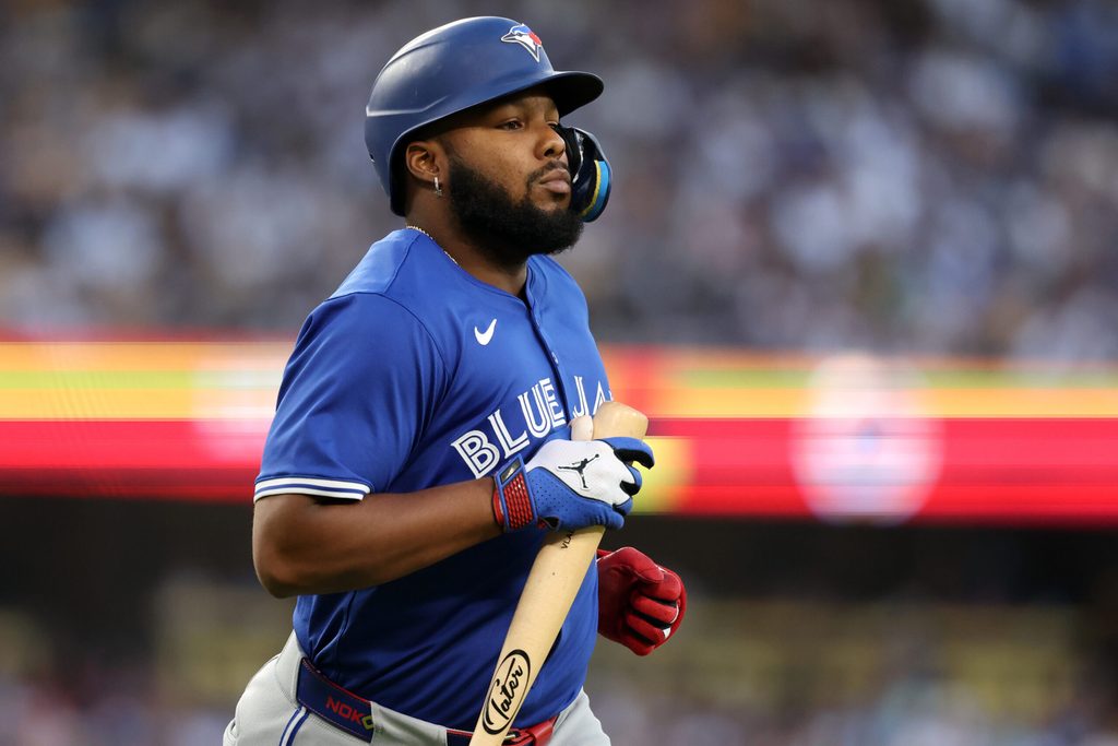 Aug 9, 2025; Los Angeles, California, USA; Toronto Blue Jays designated hitter Vladimir Guerrero Jr. (27) reacts during the fifth inning against the Los Angeles Dodgers at Dodger Stadium. Mandatory Credit: Kiyoshi Mio-Imagn Images