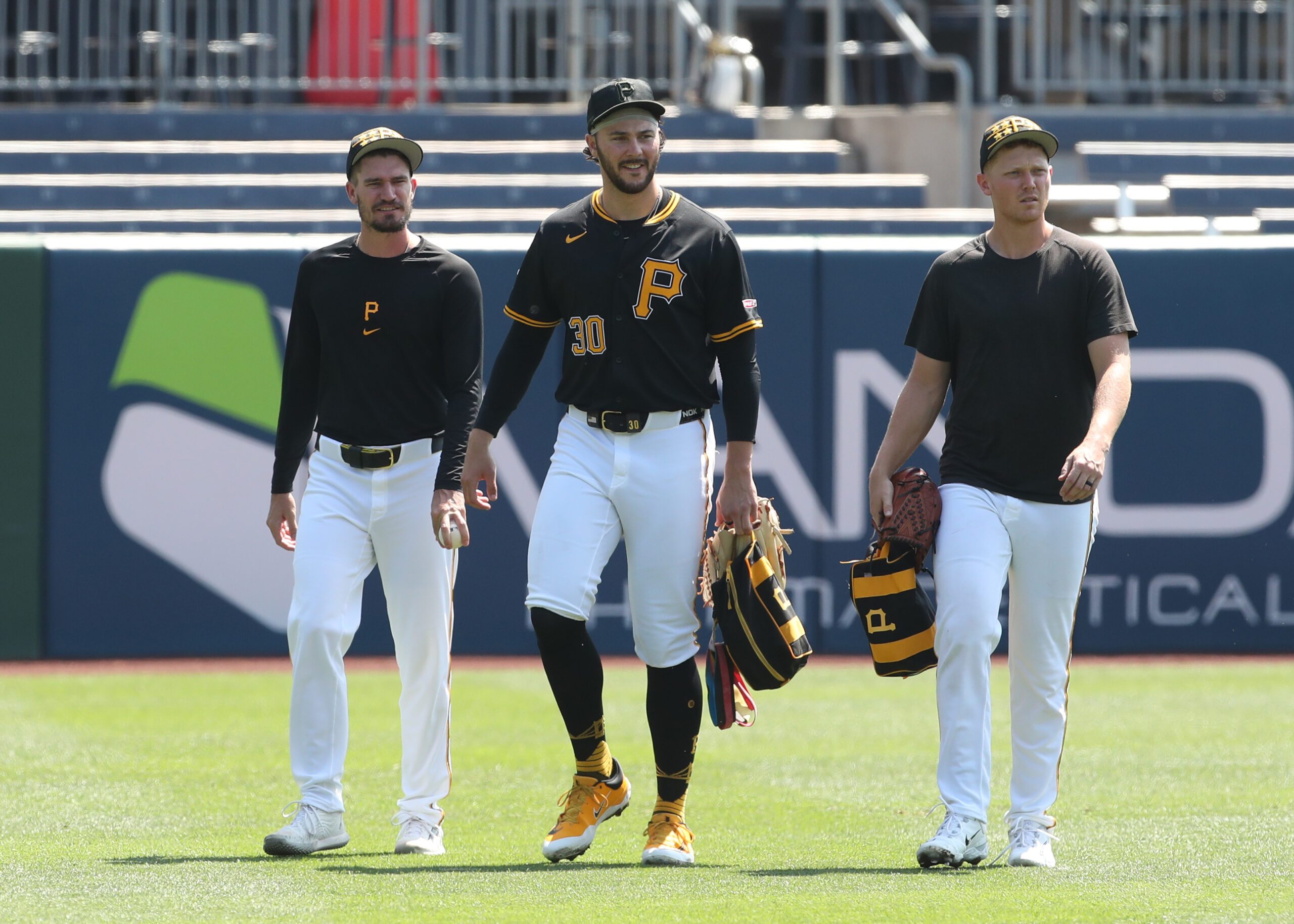 Aug 10, 2025; Pittsburgh, Pennsylvania, USA; Pittsburgh Pirates pitchers Andrew Heaney (left) and Paul Skenes (30) and Mitch Keller (right) walk in from the bullpen before the game against the Cincinnati Reds at PNC Park. Mandatory Credit: Charles LeClaire-Imagn Images