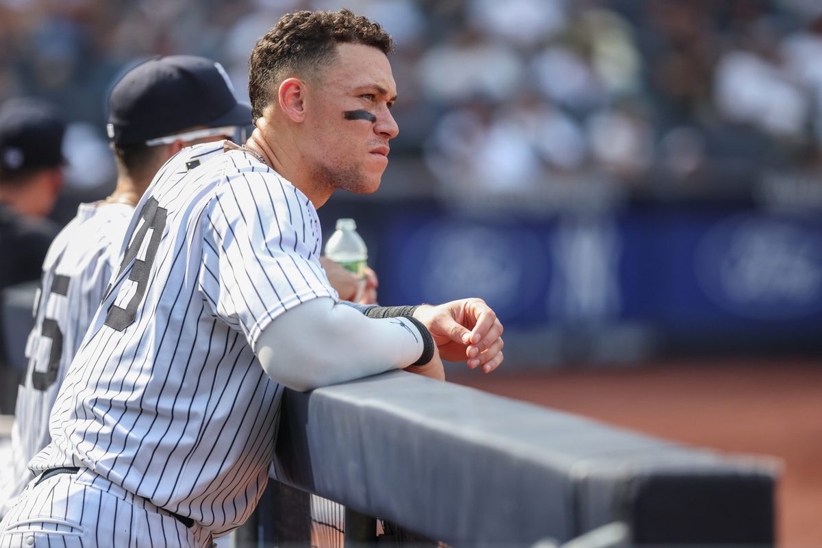 Aug 10, 2025; Bronx, New York, USA; New York Yankees designated hitter Aaron Judge (99) watches from the dugout in the ninth inning against the Houston Astros at Yankee Stadium. Mandatory Credit: Wendell Cruz-Imagn Images