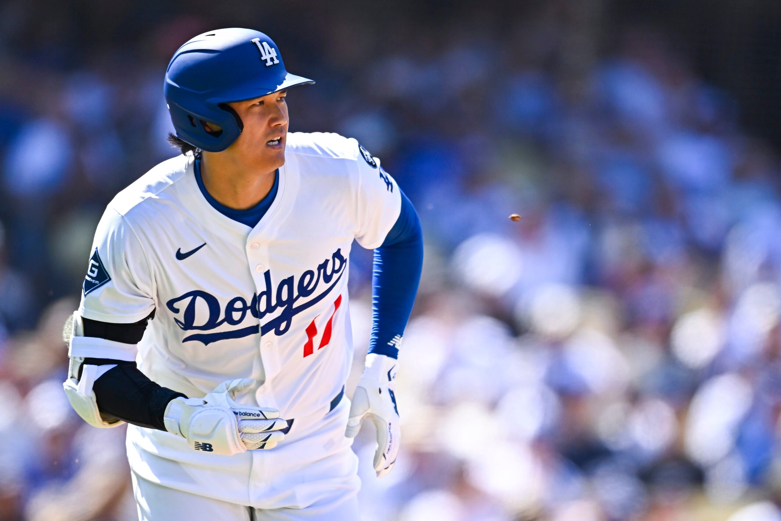 Aug 10, 2025; Los Angeles, California, USA; Los Angeles Dodgers designated hitter Shohei Ohtani (17) singles against the Toronto Blue Jays during the sixth inning at Dodger Stadium. Mandatory Credit: Jonathan Hui-Imagn Images