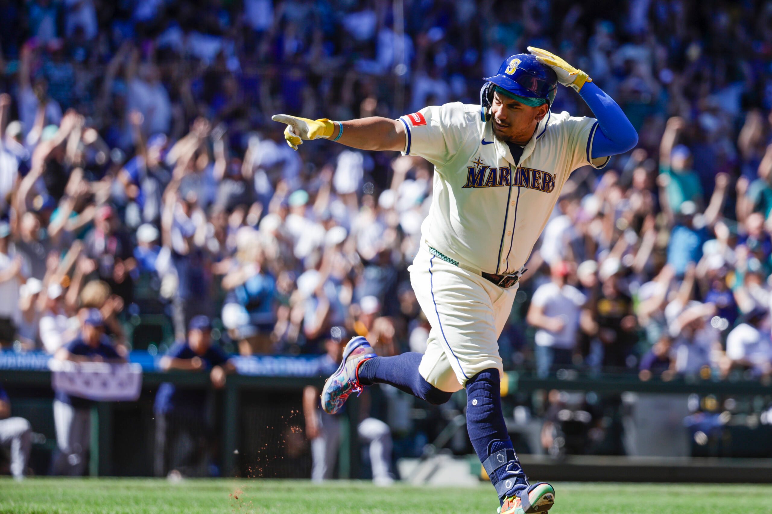 Aug 10, 2025; Seattle, Washington, USA; Seattle Mariners first baseman Josh Naylor (12) points to the Mariners dugout after hitting a solo-home run against the Tampa Bay Rays during the seventh inning at T-Mobile Park. Mandatory Credit: Joe Nicholson-Imagn Images