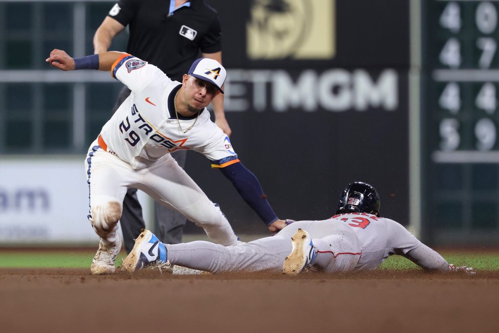 Aug 11, 2025; Houston, Texas, USA; Boston Red Sox second baseman Romy Gonzalez (23) is out on an attempted stolen base as Houston Astros secon baseman Ramon Urias (29) applies a tag during the eighth inning at Daikin Park. Mandatory Credit: Troy Taormina-Imagn Images