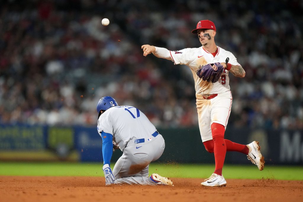 Aug 11, 2025; Anaheim, California, USA; Los Angeles Angels shortstop Zach Neto (9) forces out Los Angeles Dodgers designated hitter Shohei Ohtani (17) out at second base in the fifth inning at Angel Stadium. Mandatory Credit: Kirby Lee-Imagn Images