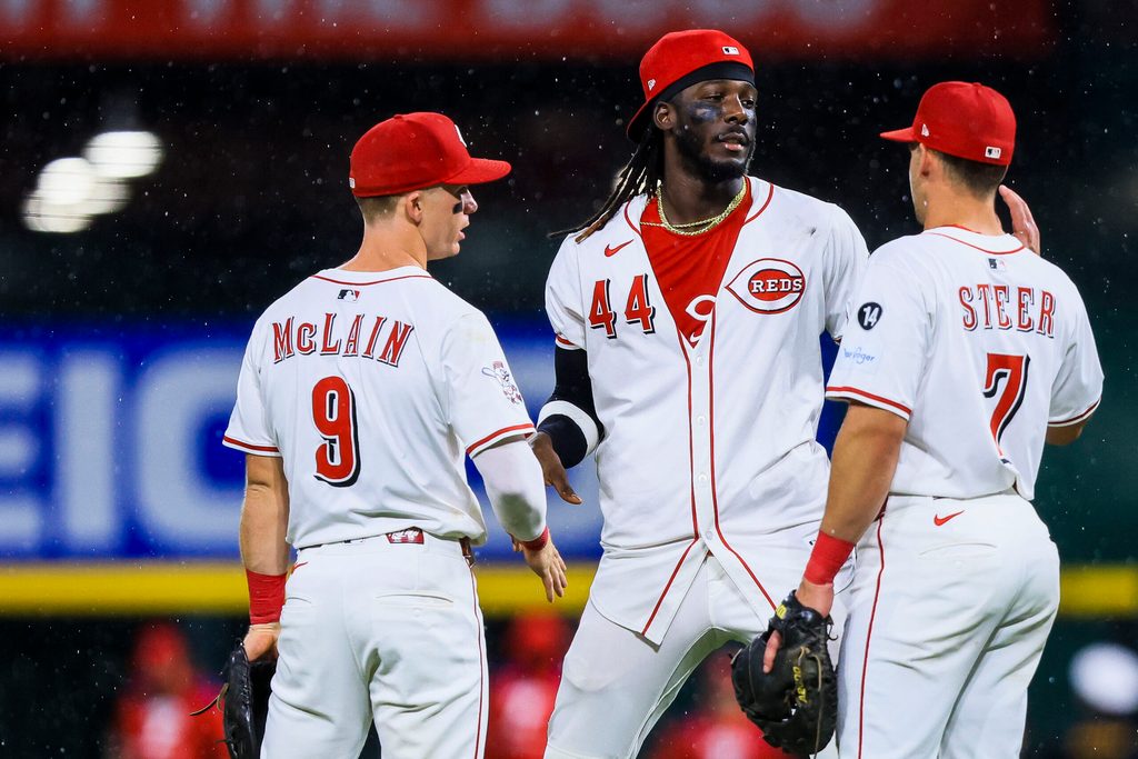 Aug 12, 2025; Cincinnati, Ohio, USA; Cincinnati Reds shortstop Elly De La Cruz (44) high fives second baseman Matt McLain (9) and first baseman Spencer Steer (7) after the victory over the Philadelphia Phillies at Great American Ball Park. Mandatory Credit: Katie Stratman-Imagn Images