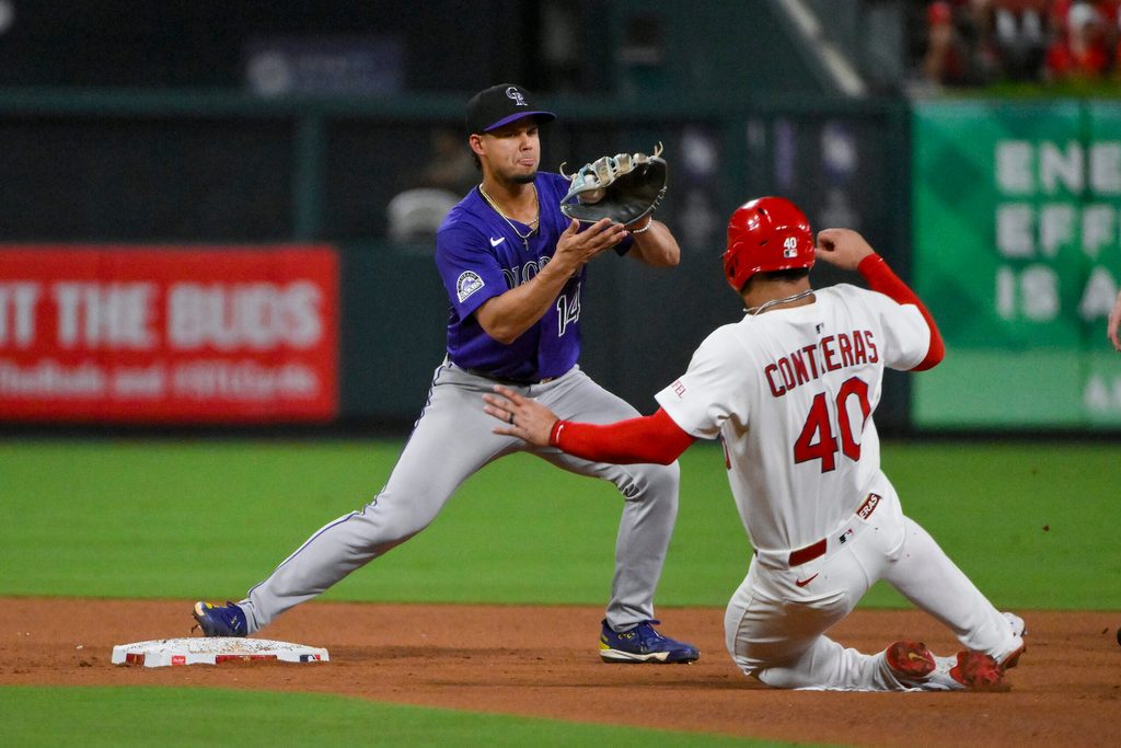 Aug 12, 2025; St. Louis, Missouri, USA; Colorado Rockies shortstop Ezequiel Tovar (14) forces out St. Louis Cardinals first baseman Willson Contreras (40) during the fourth inning at Busch Stadium. Mandatory Credit: Jeff Curry-Imagn Images